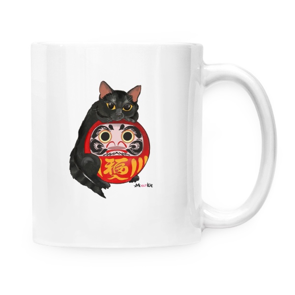 Černý kocour držící Daruma doll