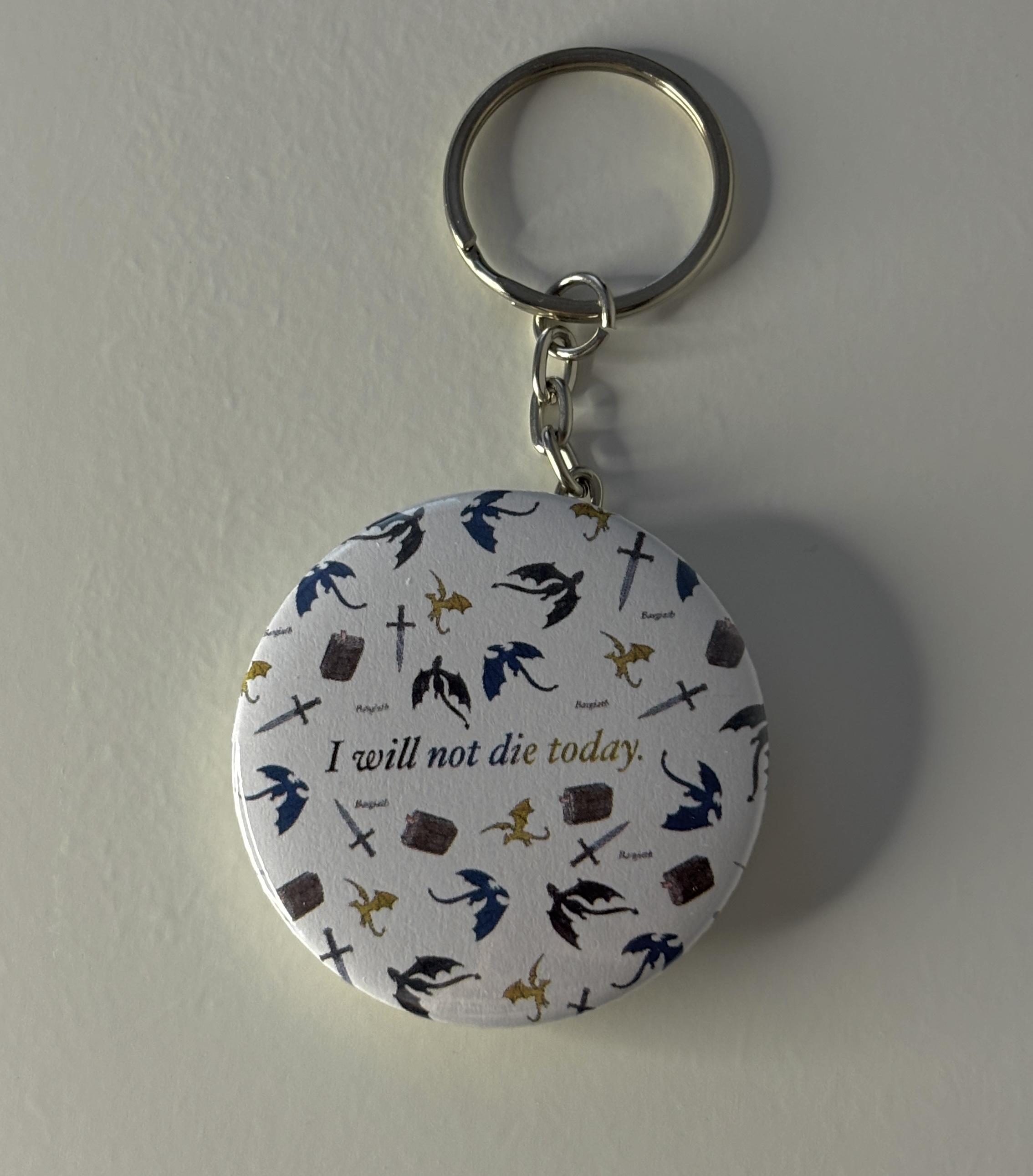 Přívěšek na klíče Čtvrté křídlo s citátem